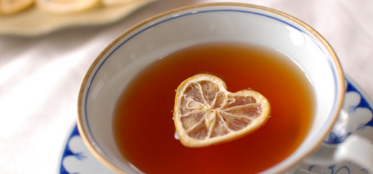 Cup with a heart-shaped lemon slice