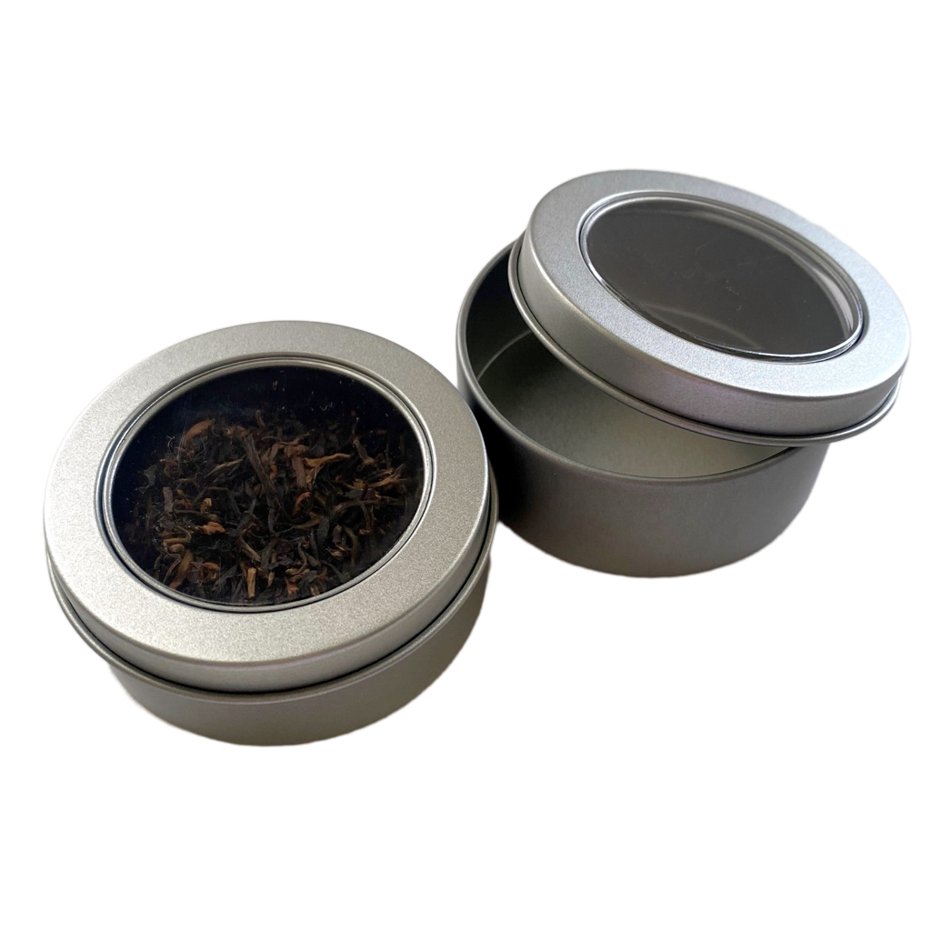 Metal can, approx. 2 oz. capacity with clear window top.